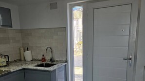 A kitchen with a sink, countertop, and cabinets. - Alba NEW I Terrace View & Heated Pool (Alhaurin de la Torre)