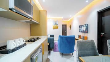 Familieleilighet, balkong, byutsikt | Eget kjøkken