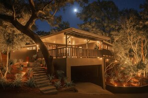 A modern house with a covered porch, a staircase leading to a deck, and a garage. - World Cup! Luxury Hollywood Retreat w/ Pool Table (West Hollywood)
