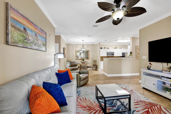 A living room with a sofa, armchairs, a coffee table, and a TV. - Travel Ball-Travel Nurses-OWA-9.7 miles To Beach (Foley)