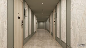 A long, narrow hallway with doors on both sides, numbered 401, leading to individual rooms.
