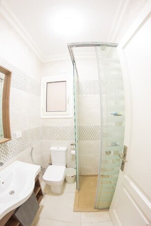 Towels, soap, toilet paper - Designer Suite by Aura: 3BR Luxury & Bespoke Art (Cairo)
