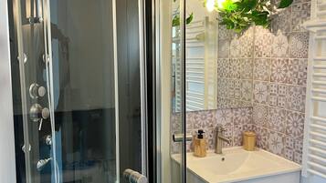 Shower, hair dryer, towels, soap