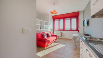 Deluxe Apartment | Living area | Flat-screen TV