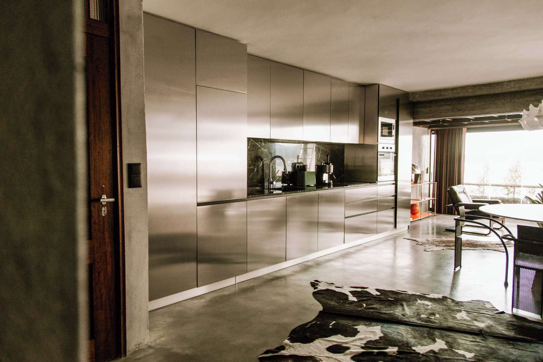 A modern kitchen with sleek cabinetry and a central island.
