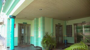 A building with a covered entrance, a bar, and a restaurant. - Green House Hotel And Suites (Lagos)