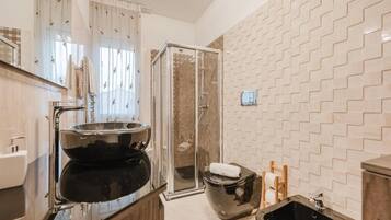 Apartment, Balcony, City View | Bathroom | Shower, free toiletries, hair dryer, bidet