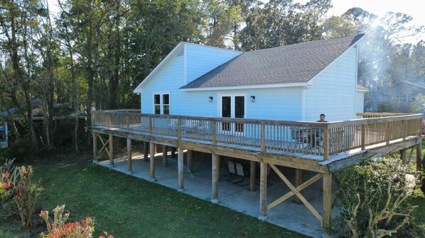 A two-story house with a wooden deck and a covered outdoor area. - Stunning Mobile Bay views near Dauphin Island (Coden)