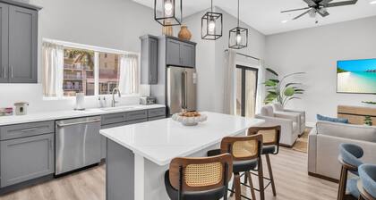 Luxury Treasure Island beach retreat with rooftop ocean views, private hot tub, game room, elevator, and beach gear. Walk just 1 block to the sand, restaurants, bars, and John’s Pass.