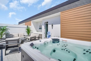 Terrace/patio - Luxury Treasure Island beach retreat with rooftop ocean views, private hot tub, game room, elevator, and beach gear. Walk just 1 block to the sand, restaurants, bars, and John’s Pass. (Treasure Island)