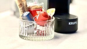 A glass container with snacks and a Krups electric kettle. - Griselini Boutique Suites (Timișoara)
