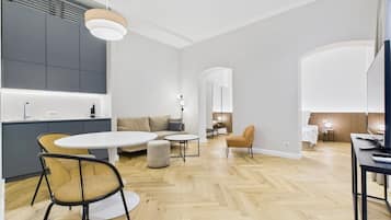 A modern interior with a kitchen, dining area, and living space.
