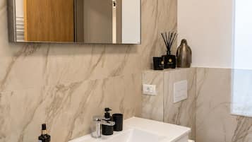 Apartment, 1 King Bed with Sofa bed, City View | Bathroom | Bathtub, towels, toilet paper