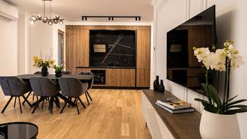 Deluxe Apartment, 2 Bedrooms, City View | Living area | TV