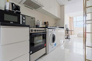 Fridge, microwave, oven, stovetop - Modern Studio with Balcony (Jumeirah Village Circle)