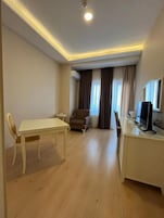 Junior Suite, Balcony, City View | Living area | TV