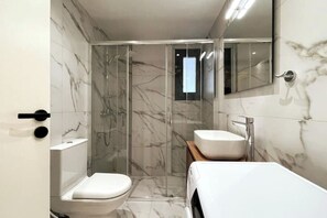 A modern bathroom with a glass-enclosed shower, a toilet, and a sink. - Athenean Gem Near Athens Metro Mall-A2 (Ilioupoli)