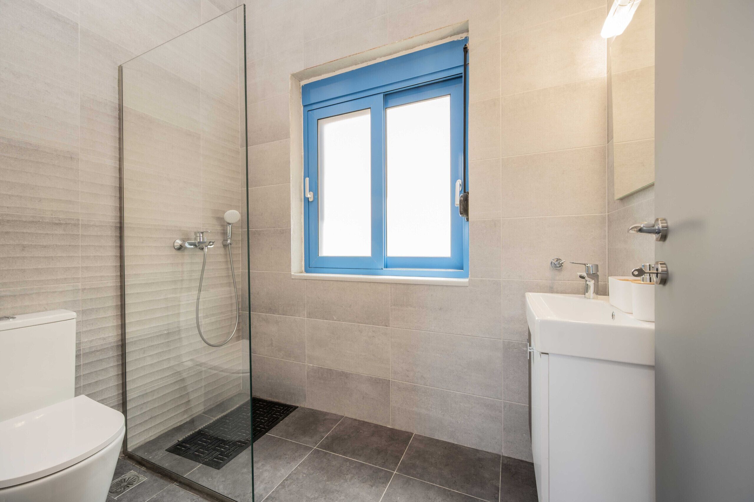 Shower, hair dryer, towels, toilet paper
