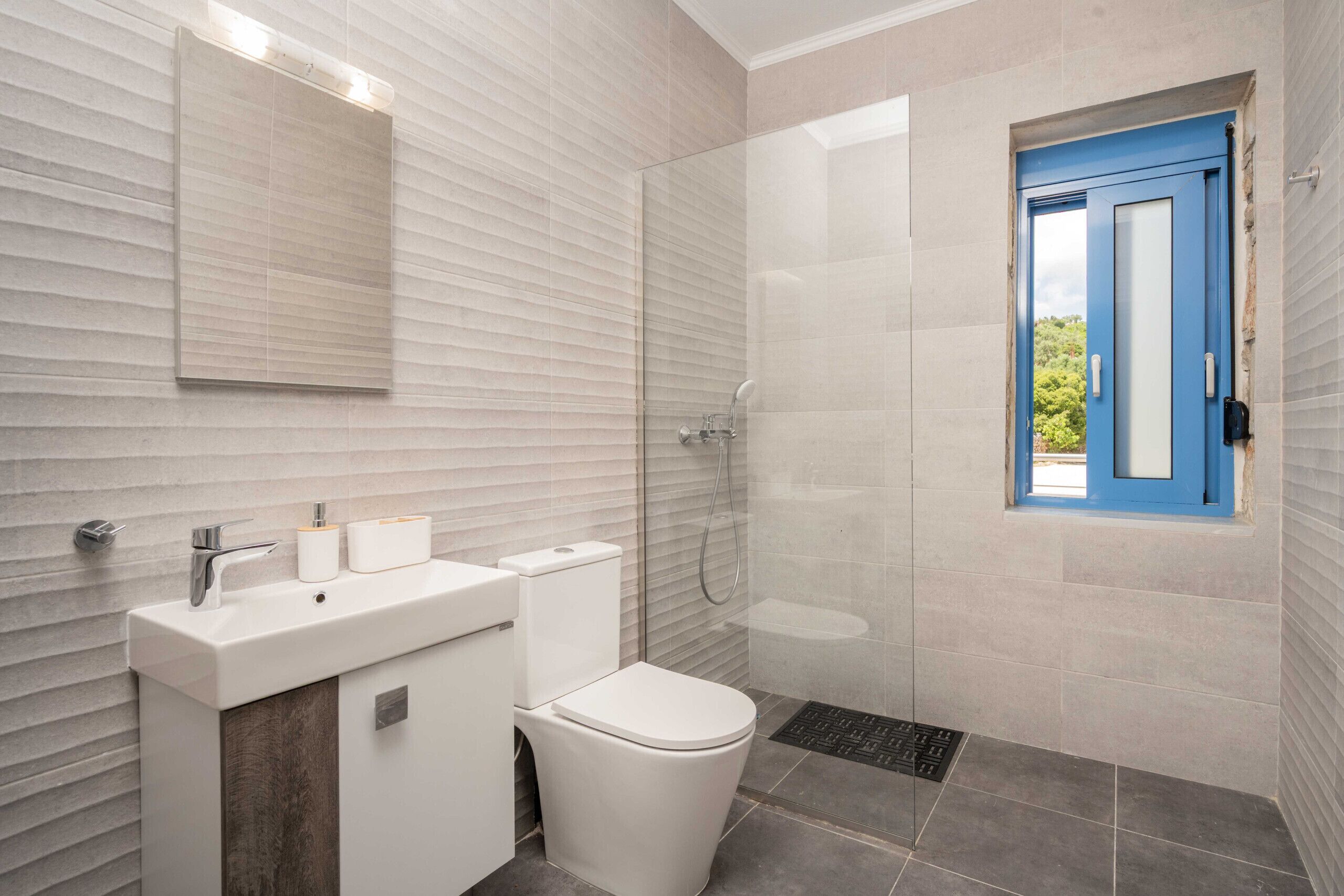 Shower, hair dryer, towels, toilet paper