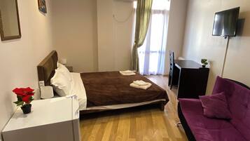 Comfort Quadruple Room, Balcony, City View