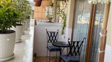 Deluxe Quadruple Room, City View | Outdoor dining