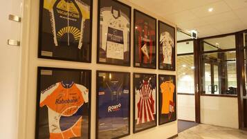 A wall with framed sports jerseys.