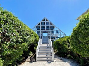 A staircase leading to a building with a triangular roof and multiple windows. - 2 BD In Heart of Seaside, Perfect for Young Families, Walk to Beach & Town (Santa Rosa Beach)
