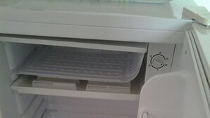 An open refrigerator with multiple shelves and a control panel. - SINGLE ROOM (Nanterre)