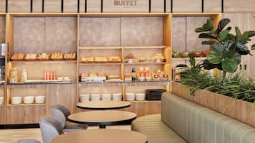 A buffet area with multiple shelves of food, seating arrangements, and a wooden wall with the word 'BUFFET' visible.