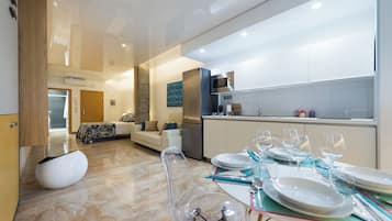 Standard Loft, City View | Living area | 52-inch Smart TV with cable channels, streaming services