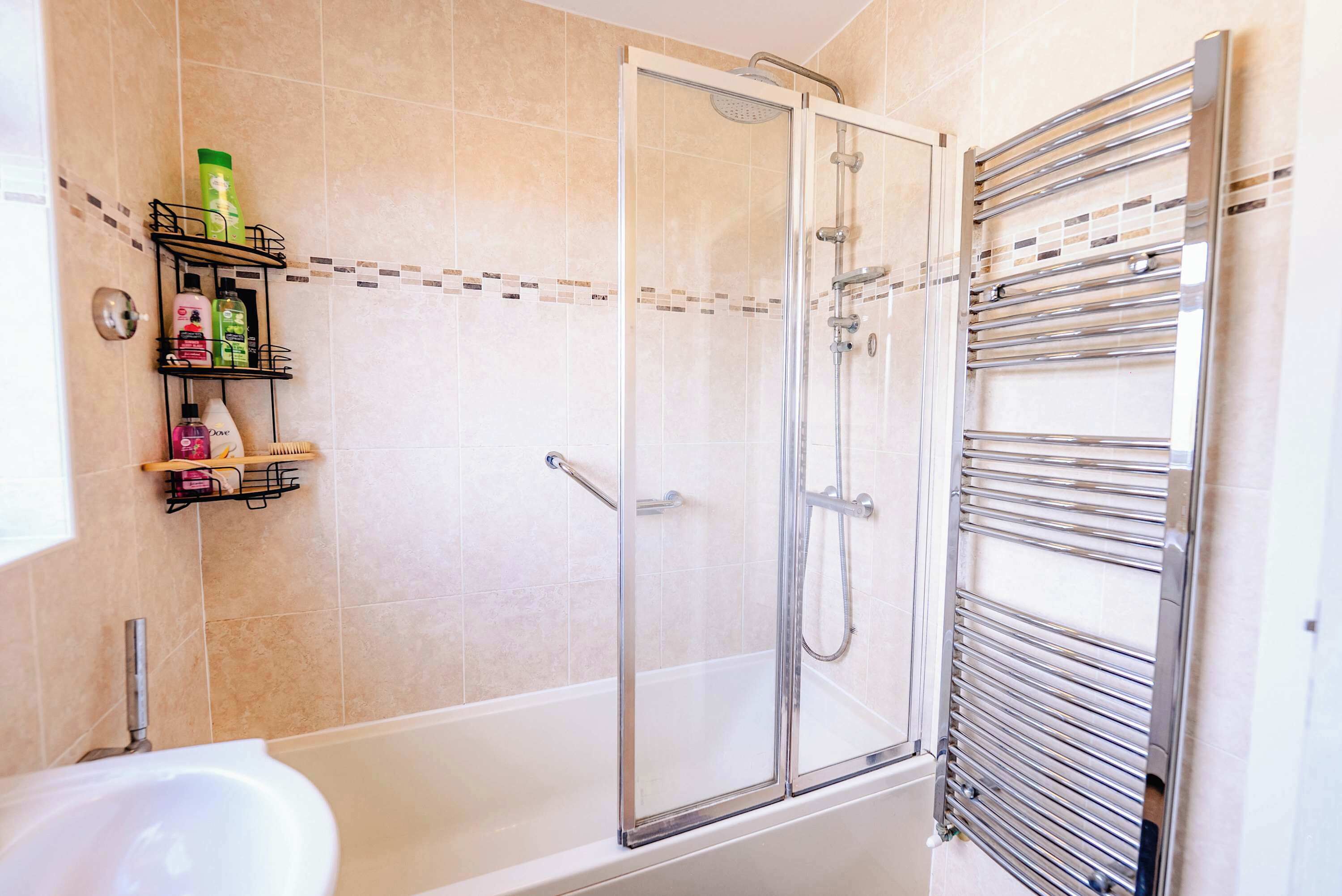 Shower, hair dryer, towels, shampoo