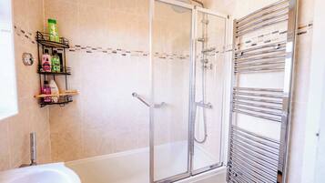 Shower, hair dryer, towels, shampoo