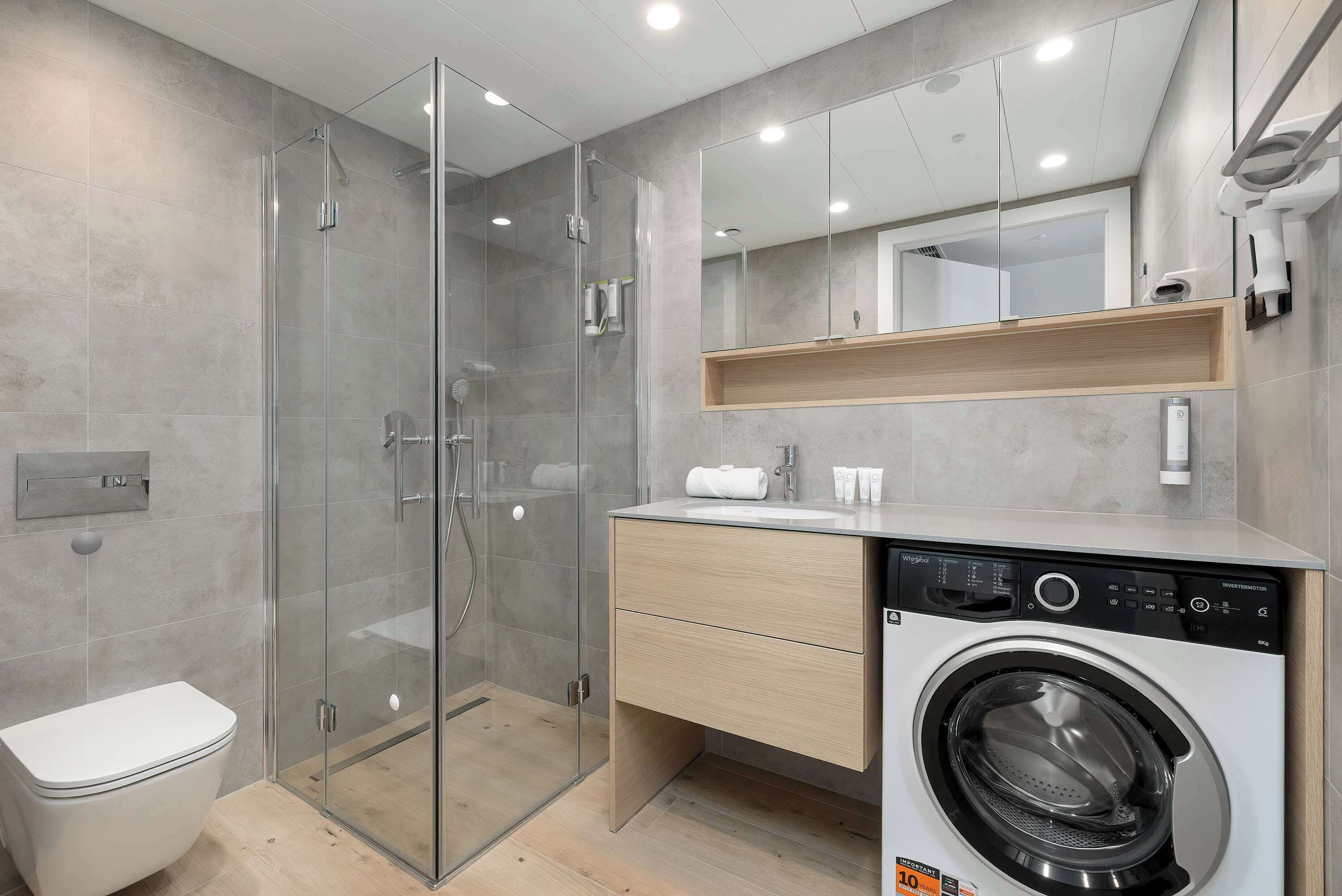 Shower, hair dryer, towels, shampoo