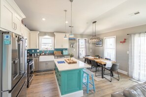 Fridge, microwave, oven, stovetop - Sun Realty pet-friendly centrally-located oceanside home in KDH! (Kill Devil Hills)