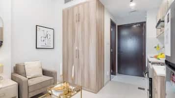 Luxury Studio, Balcony, City View | Living area | 55-inch Smart TV with cable channels