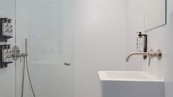 Superior Suite, Hot Tub | Bathroom | Eco-friendly toiletries, hair dryer, bathrobes, slippers