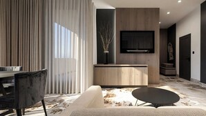 A modern living room with a sofa, a coffee table, a dining area with a table and chairs, a TV mounted on a wooden wall, and a large window with curtains. - Hotel Galaxy Timisoara, A Member Of Radisson Individuals (Timisoara)