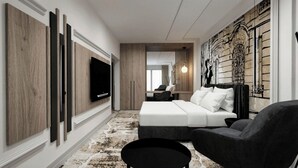 A modern hotel room with a bed, a TV, a seating area, and a decorative wall. - Hotel Galaxy Timisoara, A Member Of Radisson Individuals (Timisoara)