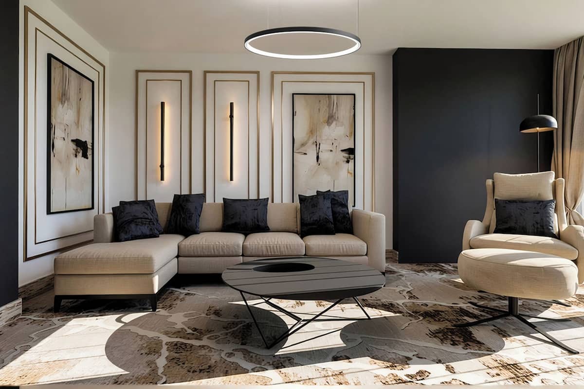 A modern living room with a sectional sofa, a round coffee table, and a high-backed armchair.
