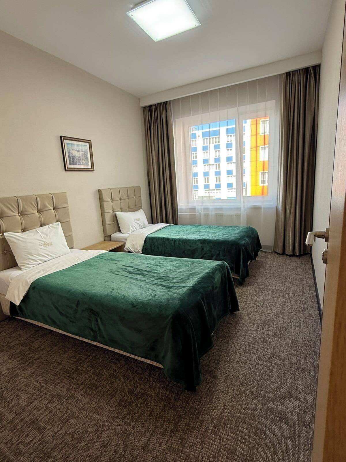 Desk, iron/ironing board, bed sheets