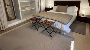 A bedroom with a bed, two nightstands, a mirror, a wardrobe, and a unique ceiling light fixture. - Guest Rooms “La Grande & La Jumelle” with Shared Terrace, Garden, and Wi-Fi (Soubrebost)