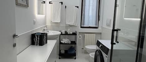 Hair dryer, bidet, towels, soap