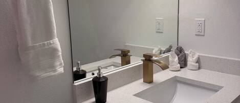 Hair dryer, towels, soap, toilet paper