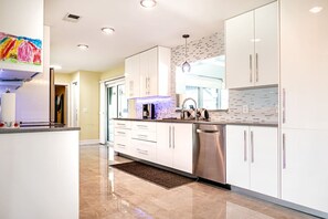 Dishwasher, coffee/tea maker, cookware/dishes/utensils, dining tables - Waterfront Pool Home Paradise! (Port St. Lucie)