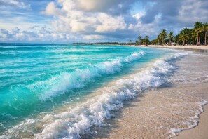 On the beach, sun-loungers, beach towels - Ocean View Apartment with Spacious Terrace – Sainte-Anne, Guadeloupe (Sainte-Anne)