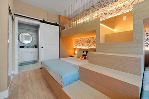 A bedroom with a bunk bed, a small desk with a lamp, and a bathroom with a mirror and sink. - Magical Mickey Retreat, Free Shuttle, Free Parking (Orlando)