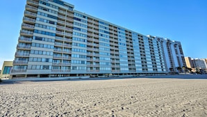 A high-rise hotel with multiple balconies, a flat facade, and a beach view. - Oceanfront Myrtle Beach Getaway w/ Balcony (Myrtle Beach)