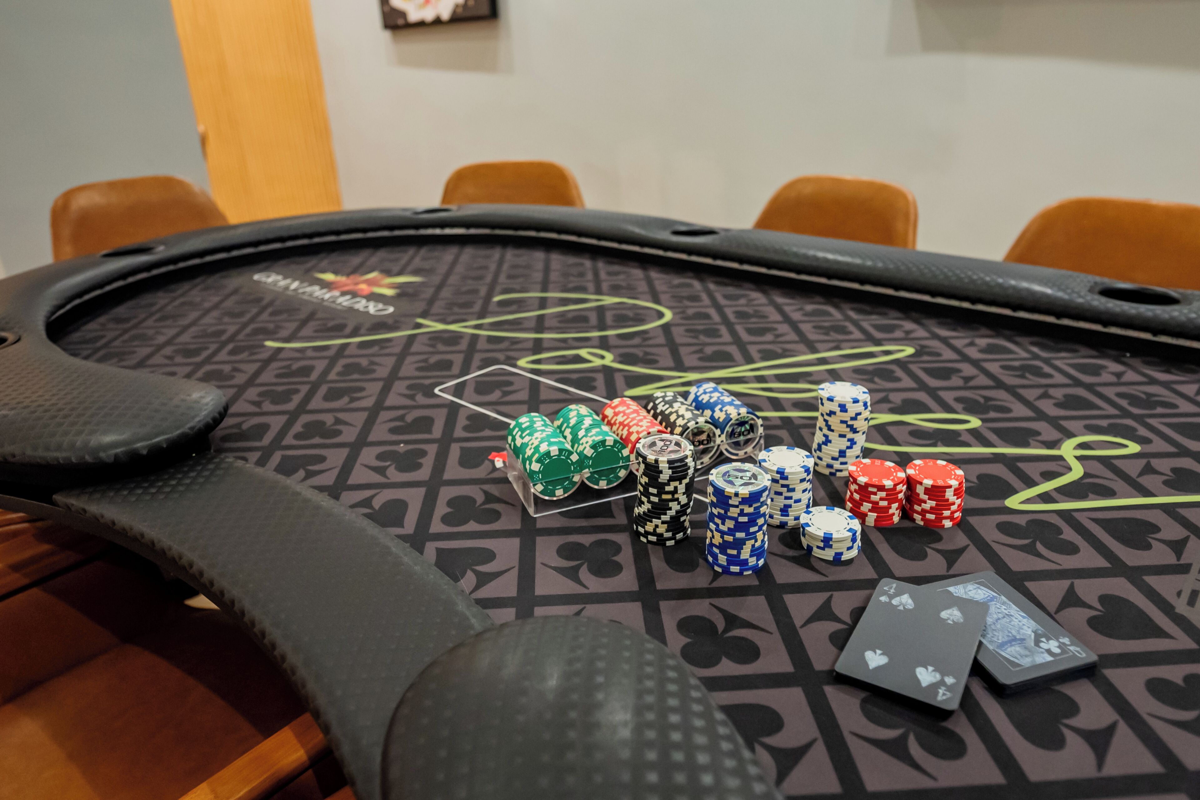 A blackjack table with chips and playing cards.