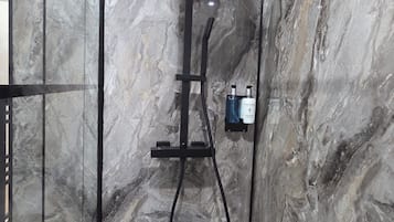 Shower, towels, soap, toilet paper