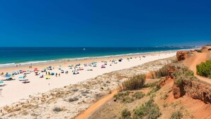 A beach with a clear sky, sandy shore, and a path leading to the water. - Vista Azul - Five Bedroom Villa, Sleeps 10 (Loulé)